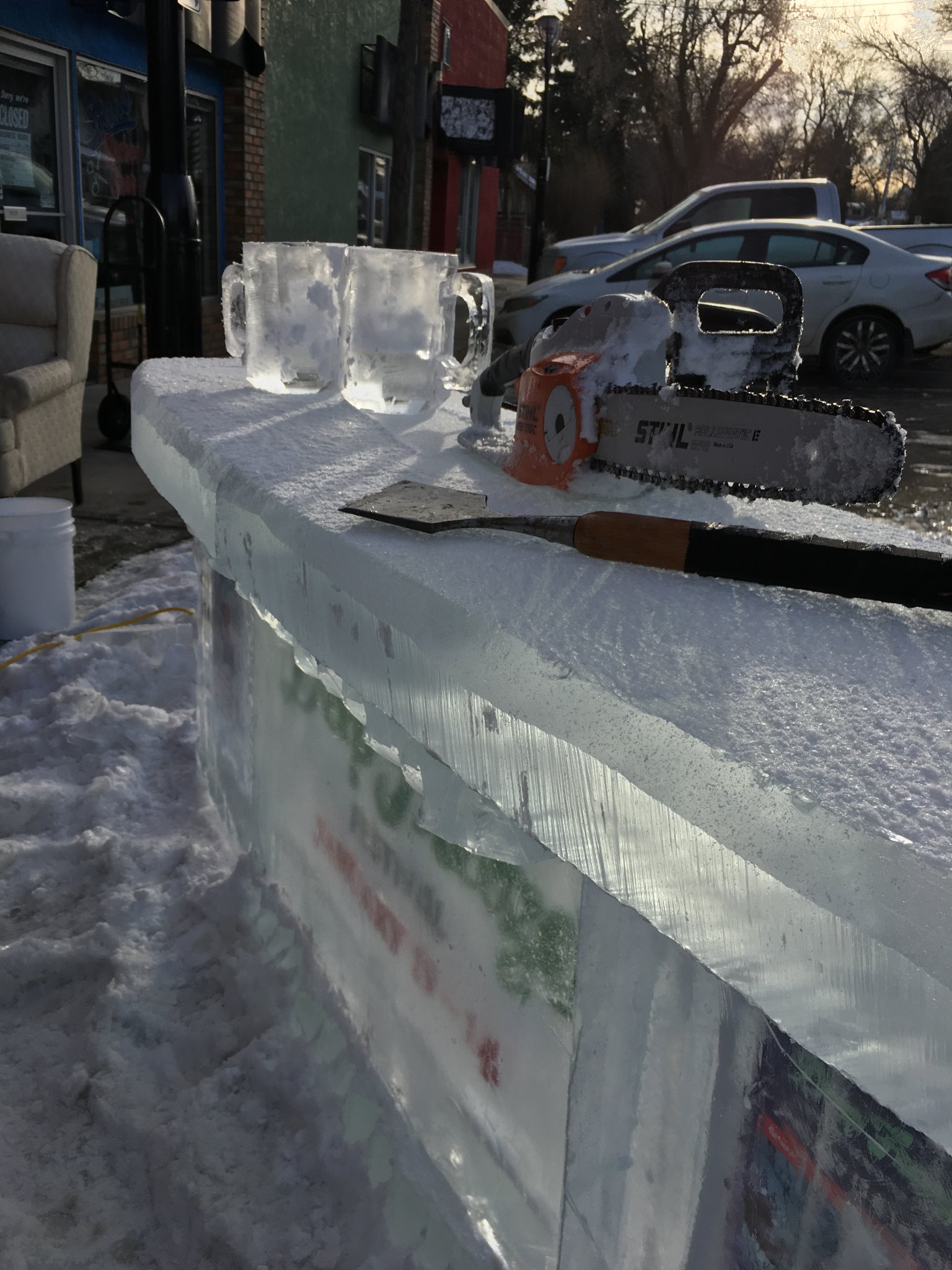 Ice bar with chainsaw at a festival